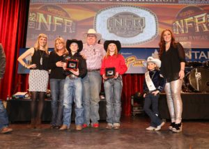 Hadley Miller, Jr. Boy Rookie of the year and Morgan Whitsett, Jr. Girl Rookie of the Year at the 2014 Montana Silversmiths buckle presentation in Las Vegas, NV