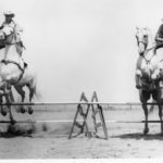 The only time and the only photo of father and son Roman riding together at the family farm. Wayne is on the left with the Flying White Clouds, and Cecil ir riding the Golden Eagles.